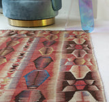 Vintage kilim rug in living room setting, bright colors, wild shaman, soft rug, bold color, Portland, Oregon, rug store, rug shop, local shop, vintage rug, modern kilim, warm colors