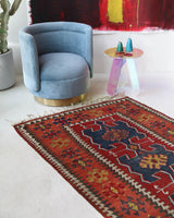 Vintage Turkish runner rug in living room setting, old rug, antique rug, pastel colors, faded colors, Turkish rug, vintage rug, soft rug, Portland, Oregon, rug store, rug shop, local shop