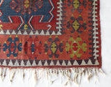 Vintage Turkish runner rug in living room setting, old rug, antique rug, pastel colors, faded colors, Turkish rug, vintage rug, soft rug, Portland, Oregon, rug store, rug shop, local shop
