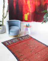 Vintage kilim rug in living room setting, old rug, antique rug, pastel colors, faded colors, Turkish rug, vintage rug, soft rug, Portland, Oregon, rug store, rug shop, local shop, earthy tones, earthy colors, warm colors