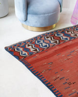 Vintage kilim rug in living room setting, old rug, antique rug, pastel colors, faded colors, Turkish rug, vintage rug, soft rug, Portland, Oregon, rug store, rug shop, local shop, earthy tones, earthy colors, warm colors