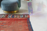Vintage kilim rug in living room setting, old rug, antique rug, pastel colors, faded colors, Turkish rug, vintage rug, soft rug, Portland, Oregon, rug store, rug shop, local shop, earthy tones, earthy colors, warm colors