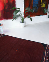 Vintage kilim rug in living room setting, bright colors, wild shaman, soft rug, bold color, Portland, Oregon, rug store, rug shop, local shop, vintage rug, modern kilim, warm colors, antique rug, antique kilim