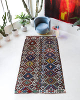 Vintage kilim rug in living room setting, bright colors, wild shaman, soft rug, bold color, Portland, Oregon, rug store, rug shop, local shop, vintage rug, modern kilim, warm colors, antique rug, antique kilim