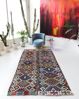 Vintage kilim rug in living room setting, bright colors, wild shaman, soft rug, bold color, Portland, Oregon, rug store, rug shop, local shop, vintage rug, modern kilim, warm colors, antique rug, antique kilim