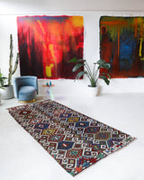Vintage kilim rug in living room setting, bright colors, wild shaman, soft rug, bold color, Portland, Oregon, rug store, rug shop, local shop, vintage rug, modern kilim, warm colors, antique rug, antique kilim