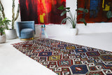 Vintage kilim rug in living room setting, bright colors, wild shaman, soft rug, bold color, Portland, Oregon, rug store, rug shop, local shop, vintage rug, modern kilim, warm colors, antique rug, antique kilim