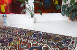 Vintage kilim rug in living room setting, bright colors, wild shaman, soft rug, bold color, Portland, Oregon, rug store, rug shop, local shop, vintage rug, modern kilim, warm colors, antique rug, antique kilim