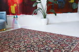 Vintage Turkish rug in a living room setting, pile rug, Turkish rug, vintage rug, portland, rug shop, bright colors, wild shaman, soft rug, bold color, Portland, Oregon, rug store, rug shop, local shop, antique rug
