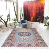 Vintage Turkish rug in living room setting, old rug, antique rug, pastel colors, faded colors, Turkish rug, vintage rug, soft rug, Portland, Oregon, rug store, rug shop, local shop