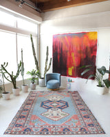 Vintage Turkish rug in living room setting, old rug, antique rug, pastel colors, faded colors, Turkish rug, vintage rug, soft rug, Portland, Oregon, rug store, rug shop, local shop