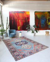 Vintage Turkish rug in living room setting, old rug, antique rug, pastel colors, faded colors, Turkish rug, vintage rug, soft rug, Portland, Oregon, rug store, rug shop, local shop
