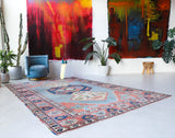 Vintage Turkish rug in living room setting, old rug, antique rug, pastel colors, faded colors, Turkish rug, vintage rug, soft rug, Portland, Oregon, rug store, rug shop, local shop