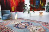 Vintage Turkish rug in living room setting, old rug, antique rug, pastel colors, faded colors, Turkish rug, vintage rug, soft rug, Portland, Oregon, rug store, rug shop, local shop