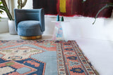 Vintage Turkish rug in living room setting, old rug, antique rug, pastel colors, faded colors, Turkish rug, vintage rug, soft rug, Portland, Oregon, rug store, rug shop, local shop