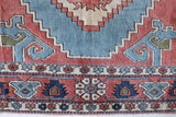 Vintage Turkish rug in living room setting, old rug, antique rug, pastel colors, faded colors, Turkish rug, vintage rug, soft rug, Portland, Oregon, rug store, rug shop, local shop