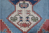 Vintage Turkish rug in living room setting, old rug, antique rug, pastel colors, faded colors, Turkish rug, vintage rug, soft rug, Portland, Oregon, rug store, rug shop, local shop