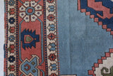 Vintage Turkish rug in living room setting, old rug, antique rug, pastel colors, faded colors, Turkish rug, vintage rug, soft rug, Portland, Oregon, rug store, rug shop, local shop