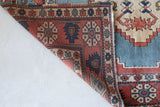 Vintage Turkish rug in living room setting, old rug, antique rug, pastel colors, faded colors, Turkish rug, vintage rug, soft rug, Portland, Oregon, rug store, rug shop, local shop