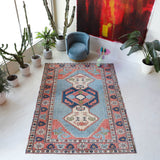 Vintage Turkish rug in living room setting, old rug, antique rug, pastel colors, faded colors, Turkish rug, vintage rug, soft rug, Portland, Oregon, rug store, rug shop, local shop
