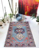 Vintage Turkish rug in living room setting, old rug, antique rug, pastel colors, faded colors, Turkish rug, vintage rug, soft rug, Portland, Oregon, rug store, rug shop, local shop