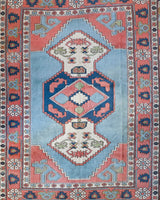 Vintage Turkish rug in living room setting, old rug, antique rug, pastel colors, faded colors, Turkish rug, vintage rug, soft rug, Portland, Oregon, rug store, rug shop, local shop