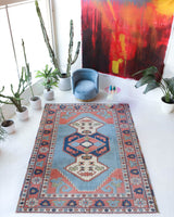 Vintage Turkish rug in living room setting, old rug, antique rug, pastel colors, faded colors, Turkish rug, vintage rug, soft rug, Portland, Oregon, rug store, rug shop, local shop