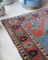 Vintage Turkish rug in living room setting, old rug, antique rug, pastel colors, faded colors, Turkish rug, vintage rug, soft rug, Portland, Oregon, rug store, rug shop, local shop