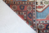 Vintage Turkish rug in living room setting, old rug, antique rug, pastel colors, faded colors, Turkish rug, vintage rug, soft rug, Portland, Oregon, rug store, rug shop, local shop