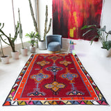 Vintage kilim rug in living room setting, bright colors, wild shaman, soft rug, bold color, Portland, Oregon, rug store, rug shop, local shop, vintage rug, modern kilim, warm colors, antique rug, antique kilim