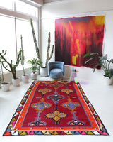 Vintage kilim rug in living room setting, bright colors, wild shaman, soft rug, bold color, Portland, Oregon, rug store, rug shop, local shop, vintage rug, modern kilim, warm colors, antique rug, antique kilim