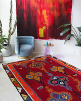 Vintage kilim rug in living room setting, bright colors, wild shaman, soft rug, bold color, Portland, Oregon, rug store, rug shop, local shop, vintage rug, modern kilim, warm colors, antique rug, antique kilim