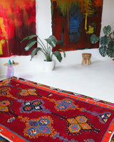 Vintage kilim rug in living room setting, bright colors, wild shaman, soft rug, bold color, Portland, Oregon, rug store, rug shop, local shop, vintage rug, modern kilim, warm colors, antique rug, antique kilim