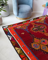 Vintage kilim rug in living room setting, bright colors, wild shaman, soft rug, bold color, Portland, Oregon, rug store, rug shop, local shop, vintage rug, modern kilim, warm colors, antique rug, antique kilim