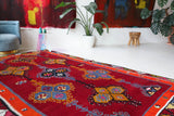 Vintage kilim rug in living room setting, bright colors, wild shaman, soft rug, bold color, Portland, Oregon, rug store, rug shop, local shop, vintage rug, modern kilim, warm colors, antique rug, antique kilim