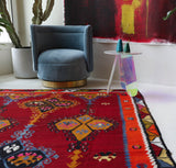 Vintage kilim rug in living room setting, bright colors, wild shaman, soft rug, bold color, Portland, Oregon, rug store, rug shop, local shop, vintage rug, modern kilim, warm colors, antique rug, antique kilim
