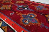 Vintage kilim rug in living room setting, bright colors, wild shaman, soft rug, bold color, Portland, Oregon, rug store, rug shop, local shop, vintage rug, modern kilim, warm colors, antique rug, antique kilim