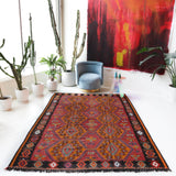 Vintage kilim rug in living room setting, bright colors, wild shaman, soft rug, bold color, Portland, Oregon, rug store, rug shop, local shop, vintage rug, modern kilim, warm colors, antique rug, antique kilim