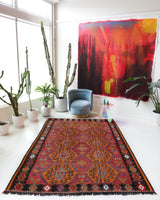 Vintage kilim rug in living room setting, bright colors, wild shaman, soft rug, bold color, Portland, Oregon, rug store, rug shop, local shop, vintage rug, modern kilim, warm colors, antique rug, antique kilim