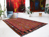 Vintage kilim rug in living room setting, bright colors, wild shaman, soft rug, bold color, Portland, Oregon, rug store, rug shop, local shop, vintage rug, modern kilim, warm colors, antique rug, antique kilim