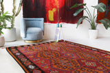 Vintage kilim rug in living room setting, bright colors, wild shaman, soft rug, bold color, Portland, Oregon, rug store, rug shop, local shop, vintage rug, modern kilim, warm colors, antique rug, antique kilim