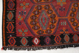 Vintage kilim rug in living room setting, bright colors, wild shaman, soft rug, bold color, Portland, Oregon, rug store, rug shop, local shop, vintage rug, modern kilim, warm colors, antique rug, antique kilim