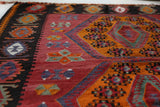 Vintage kilim rug in living room setting, bright colors, wild shaman, soft rug, bold color, Portland, Oregon, rug store, rug shop, local shop, vintage rug, modern kilim, warm colors, antique rug, antique kilim