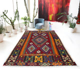 Vintage kilim rug in living room setting, bright colors, wild shaman, soft rug, bold color, Portland, Oregon, rug store, rug shop, local shop, vintage rug, modern kilim, warm colors, antique rug, antique kilim