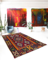 Vintage kilim rug in living room setting, bright colors, wild shaman, soft rug, bold color, Portland, Oregon, rug store, rug shop, local shop, vintage rug, modern kilim, warm colors, antique rug, antique kilim