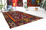 Vintage kilim rug in living room setting, bright colors, wild shaman, soft rug, bold color, Portland, Oregon, rug store, rug shop, local shop, vintage rug, modern kilim, warm colors, antique rug, antique kilim