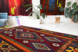Vintage kilim rug in living room setting, bright colors, wild shaman, soft rug, bold color, Portland, Oregon, rug store, rug shop, local shop, vintage rug, modern kilim, warm colors, antique rug, antique kilim