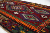 Vintage kilim rug in living room setting, bright colors, wild shaman, soft rug, bold color, Portland, Oregon, rug store, rug shop, local shop, vintage rug, modern kilim, warm colors, antique rug, antique kilim
