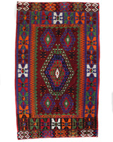 Vintage kilim rug in living room setting, bright colors, wild shaman, soft rug, bold color, Portland, Oregon, rug store, rug shop, local shop, vintage rug, modern kilim, warm colors, antique rug, antique kilim