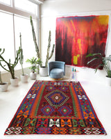 Vintage kilim rug in living room setting, bright colors, wild shaman, soft rug, bold color, Portland, Oregon, rug store, rug shop, local shop, vintage rug, modern kilim, warm colors, antique rug, antique kilim